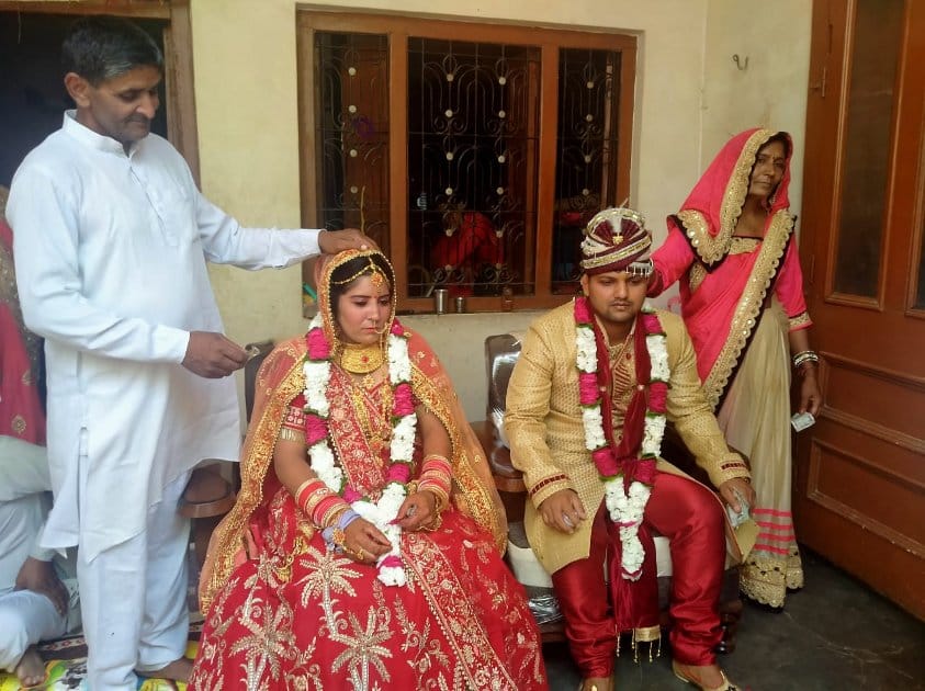 Welcoming of Baratis with sanitizer, masks worn in place of garlands