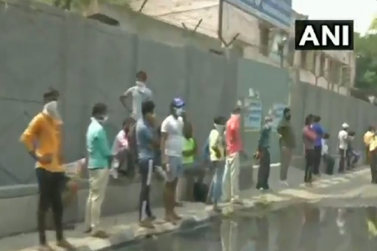More than a kilometre long queue outside a liquor shop in Kalyan Puri Delhi