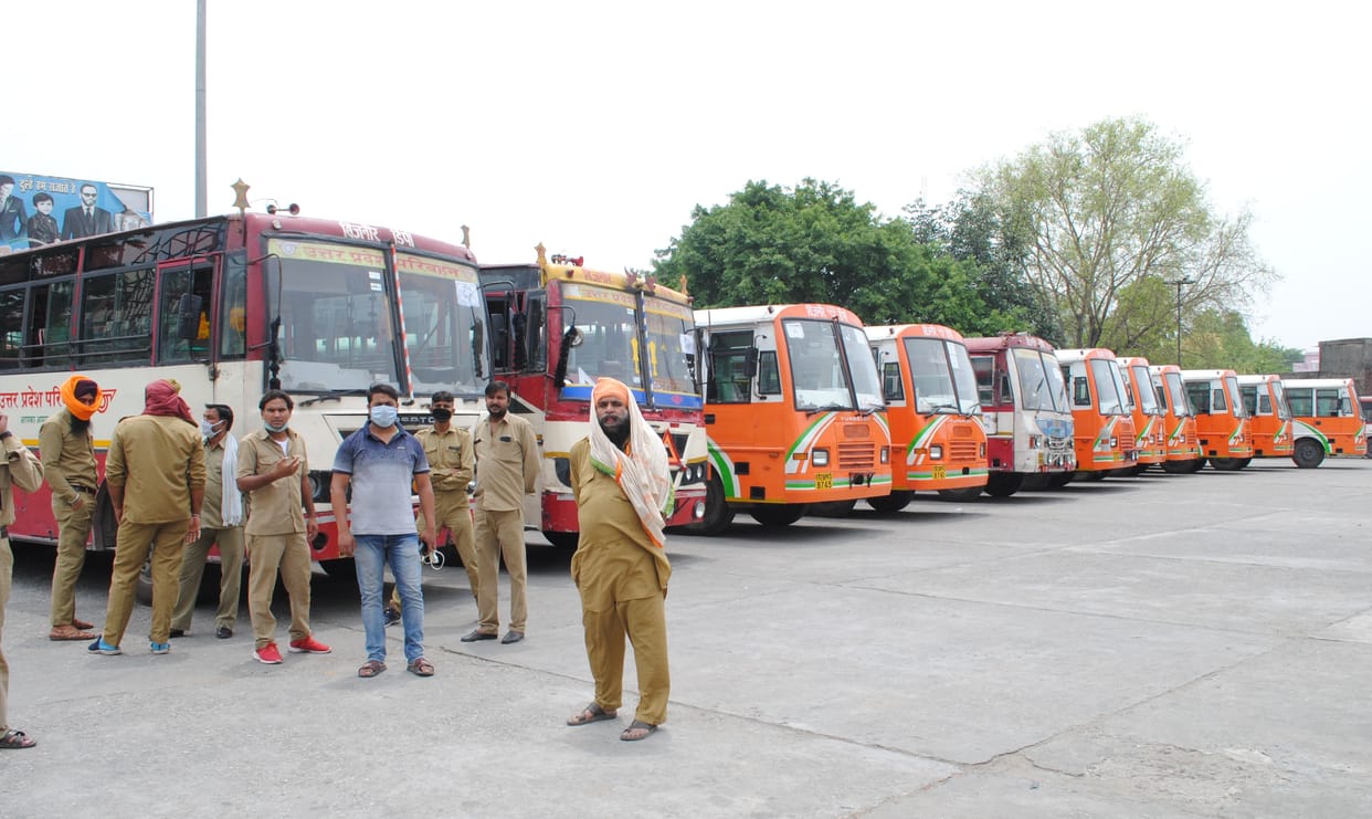365 workers from outlying districts sent by buses