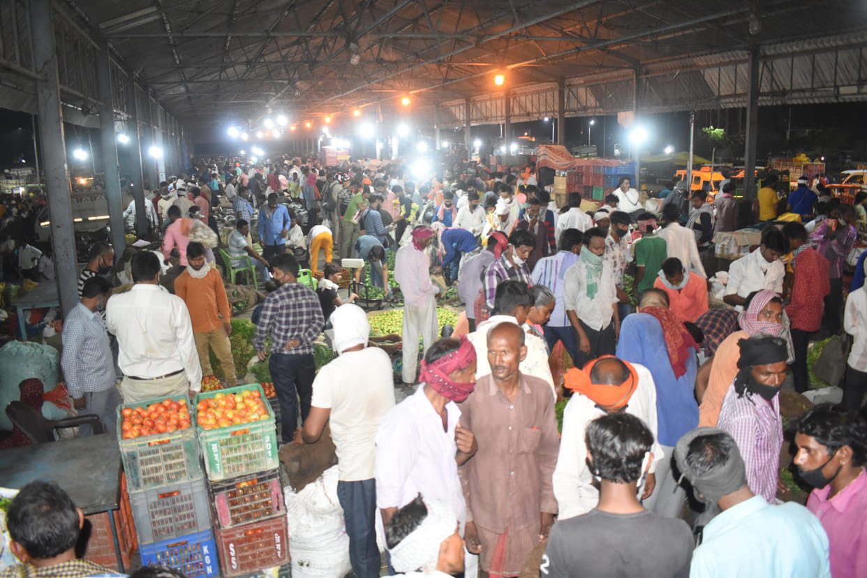 Crowd gathering in vegetable market, bypassing social distancing