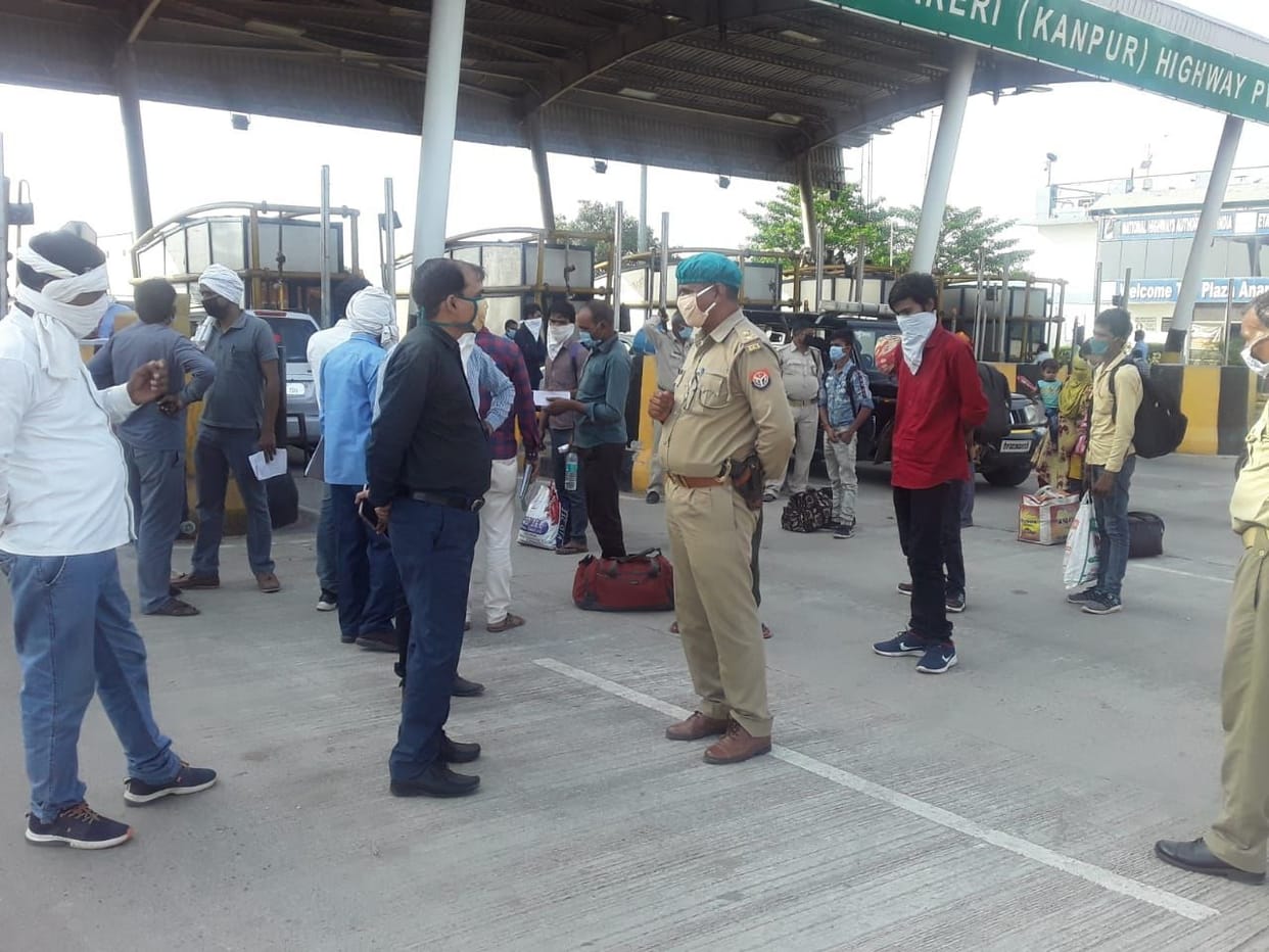 Crowd of migrant laborers at toll plaza
