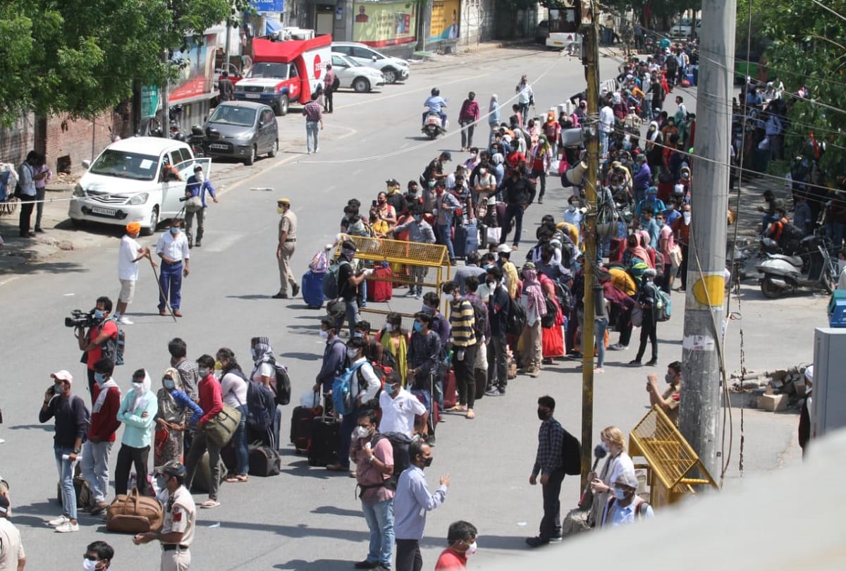 railways service resume new delhi railway station huge crowd long queue passengers
