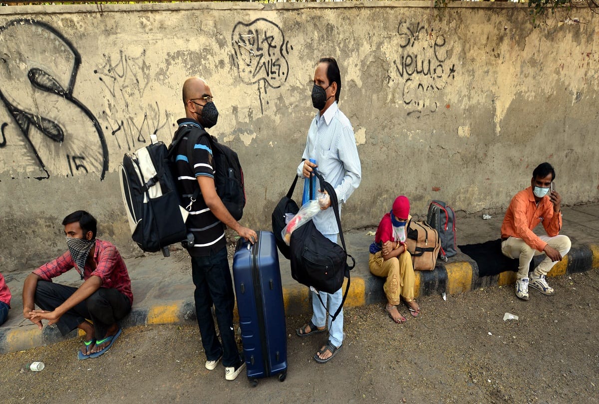 railways service resume new delhi railway station huge crowd long queue passengers