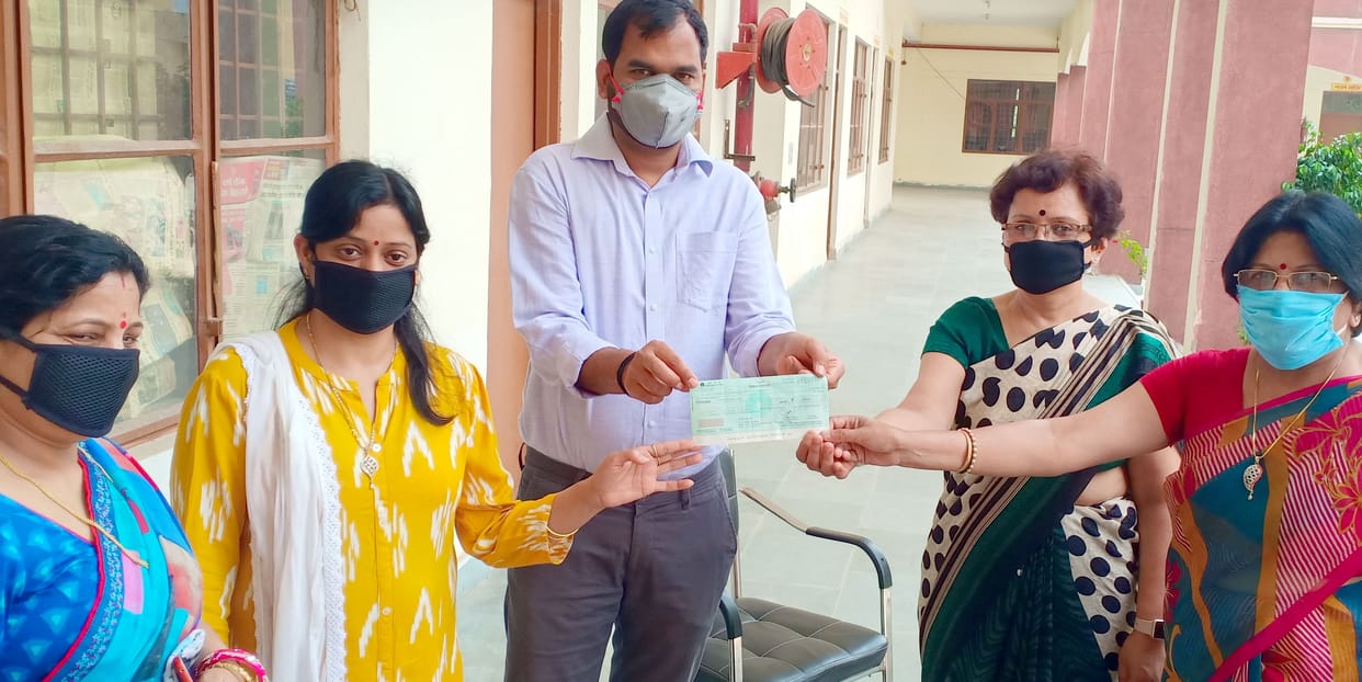 11 thousand rupees aid check handed over