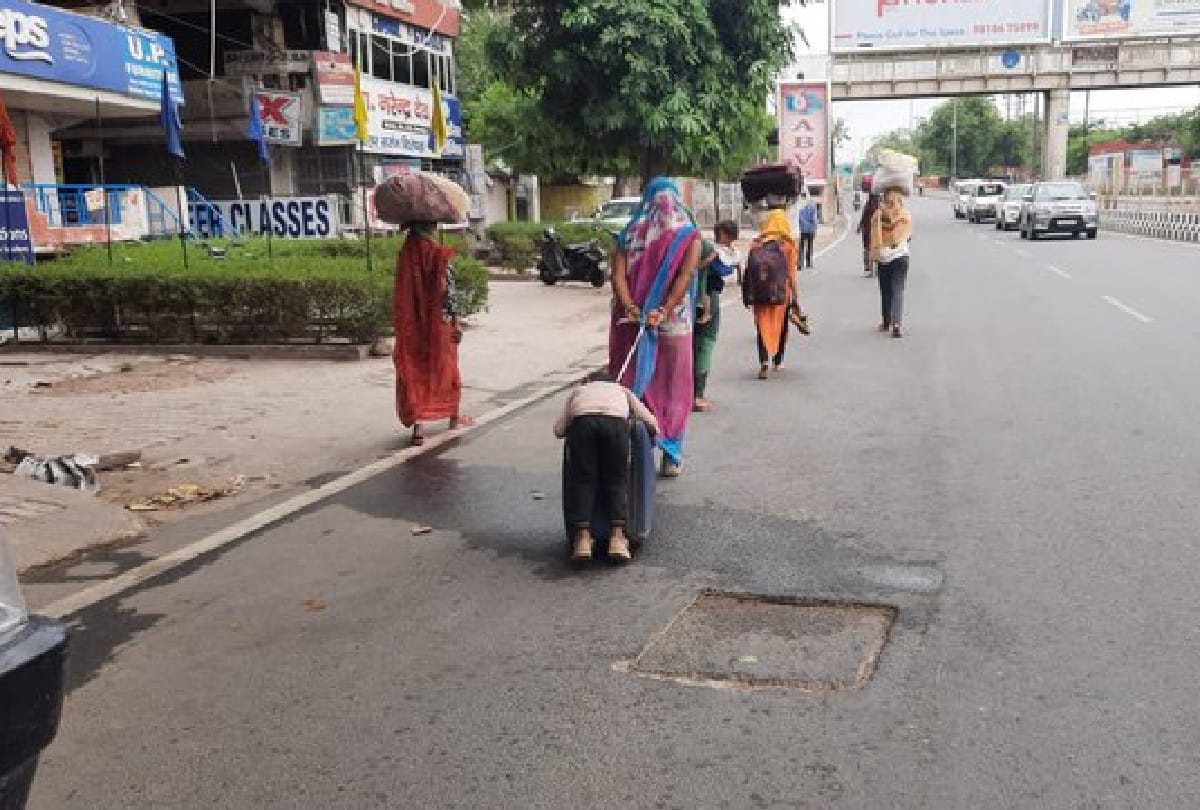 coronavirus lockdown: migrant workers mother carrying son on briefcase video goes viral in agra