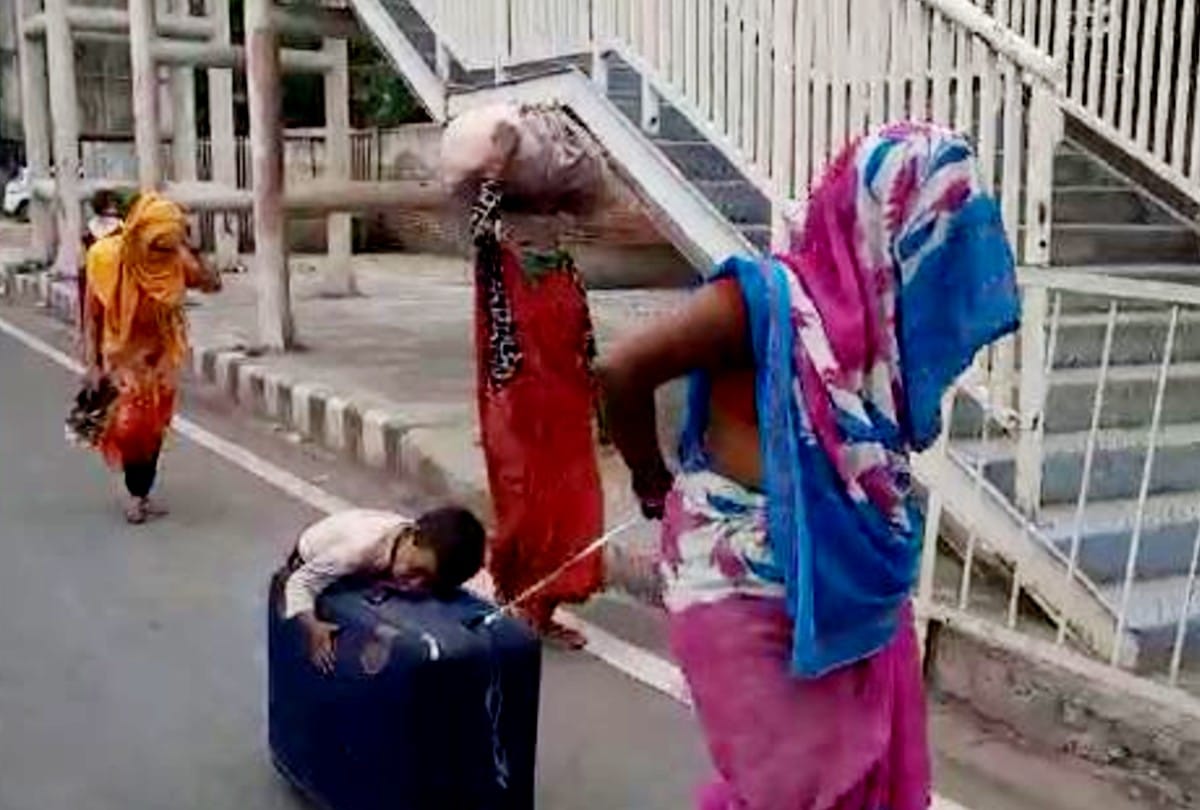 coronavirus lockdown: migrant workers mother carrying son on briefcase video goes viral in agra