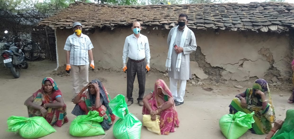 Needy women help to ration kit