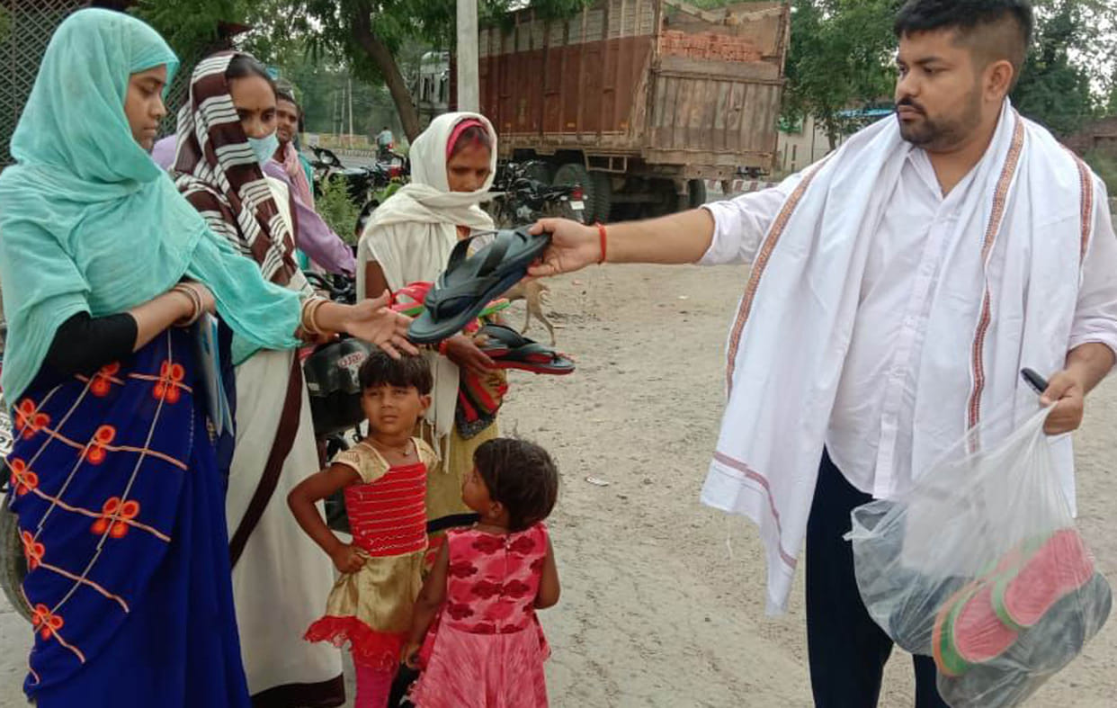 Footwear distributed to the walking laborers