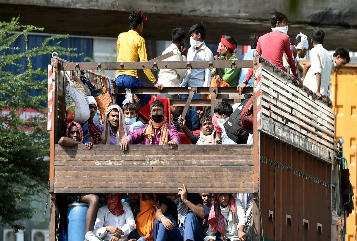 coronavirus lockdown migrant labourers photo who return home journey by truck cycle and by foot