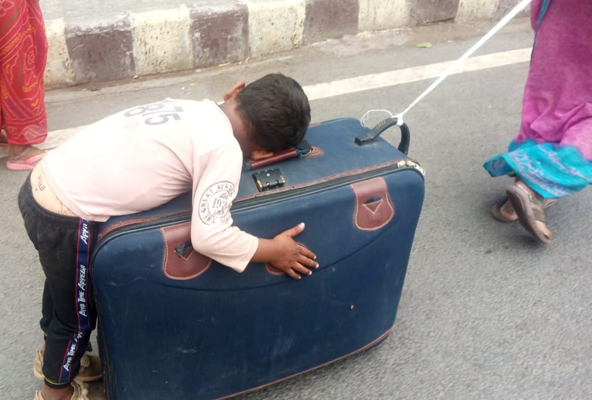 nhrc issues notice to agra dm for migrant mother pulling suitcase with son in lockdown