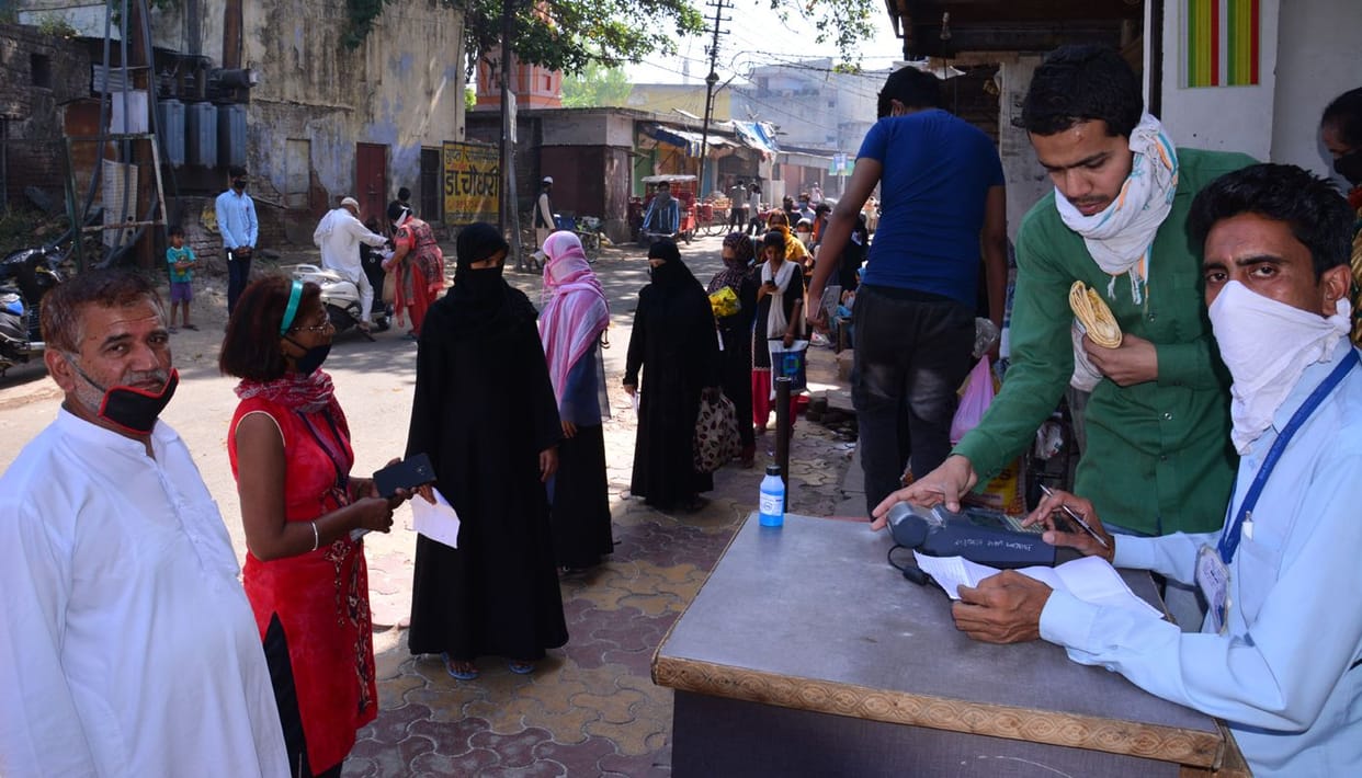 Waiting for ration in scorching afternoon