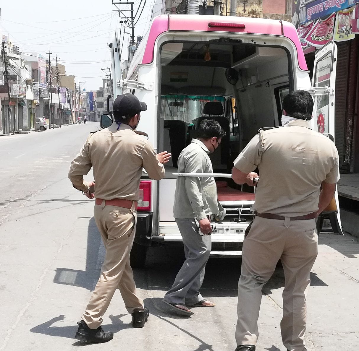 police siitng the road walkers in ambulance at superlock down season