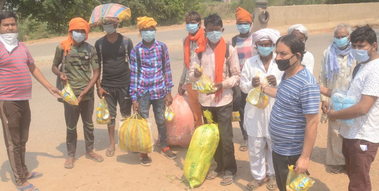 Hands extended, food and water to help