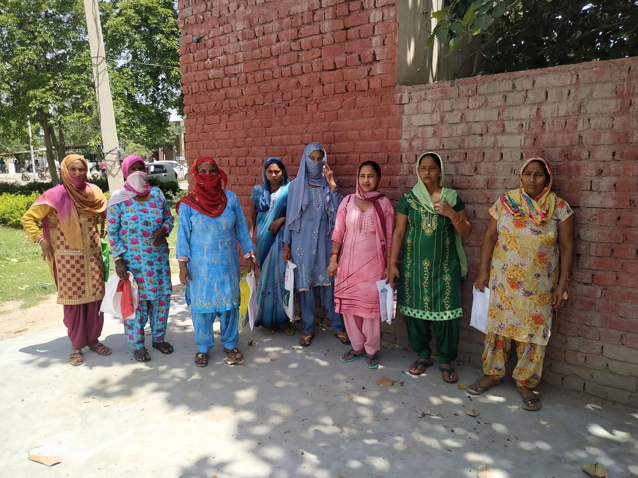woman reach food supply office for token