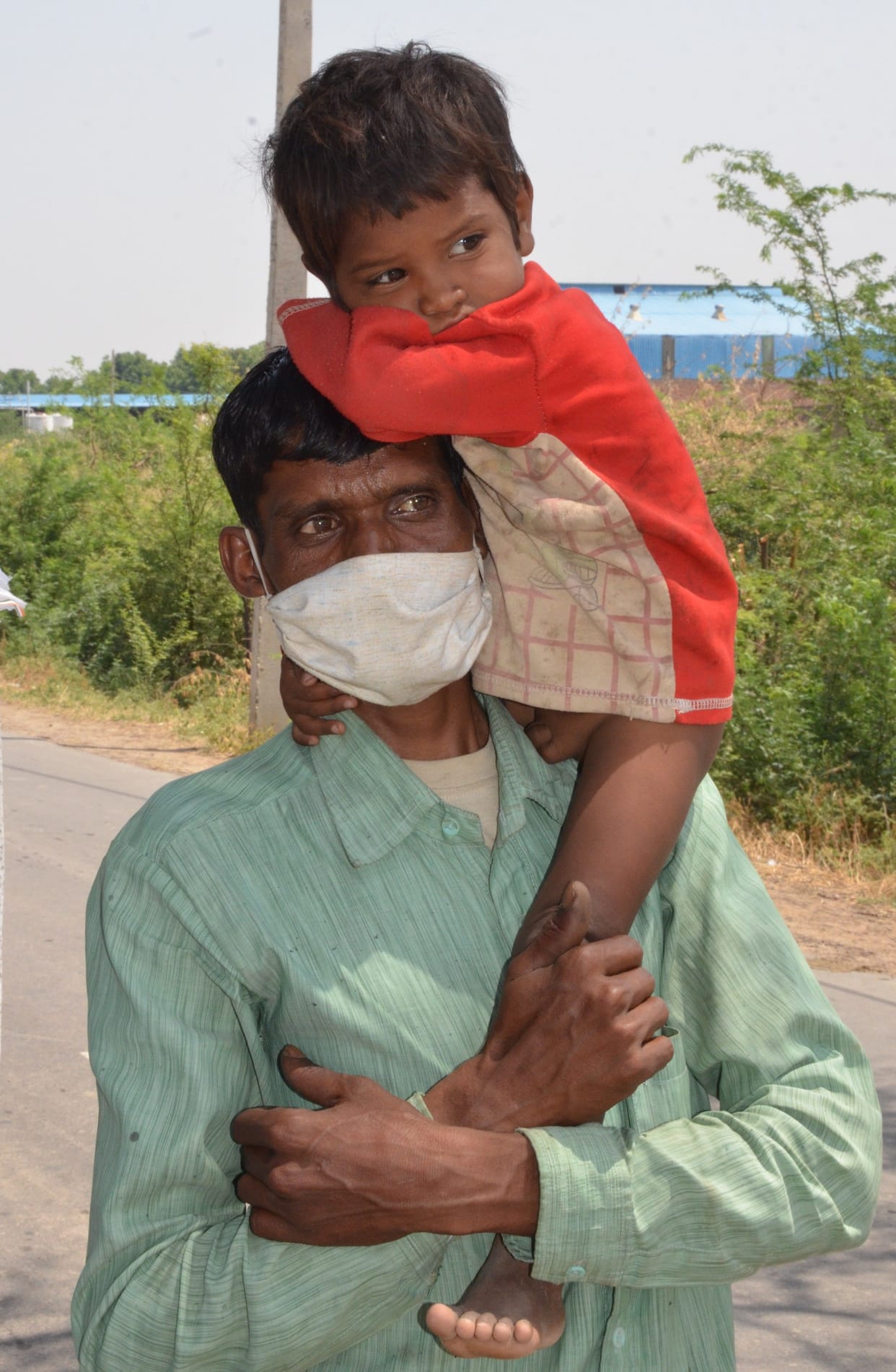 Migrant laborers migrating under compulsion on foot.