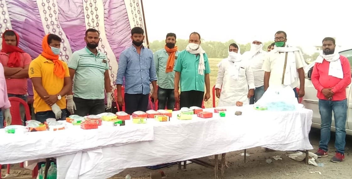 Volunteers engaged in providing food to workers