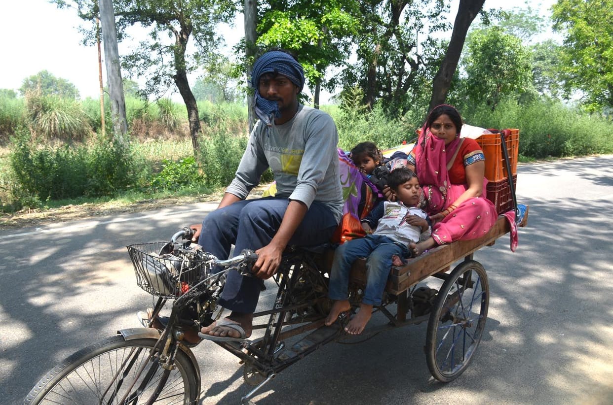 Migrant workers forced to go home by rickshaw
