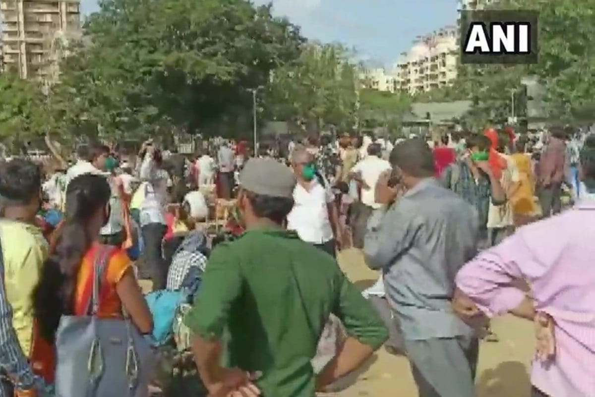 migrant labourers gather at Kandivali ground after two of three trains scheduled to leave for UP cancelled