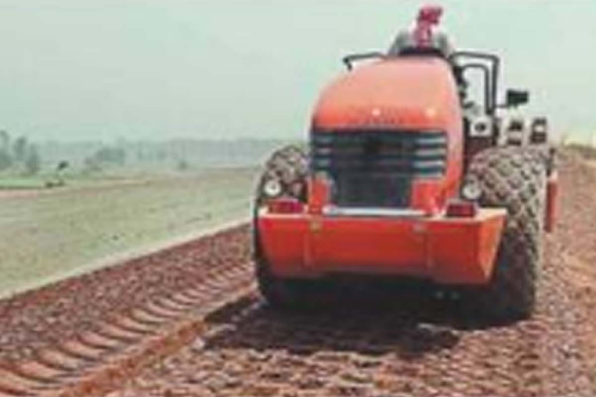 Machines started running on expressway, red gravel started