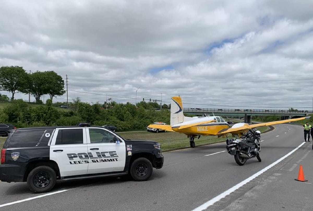 Plane emergency landing between moving cars on highway