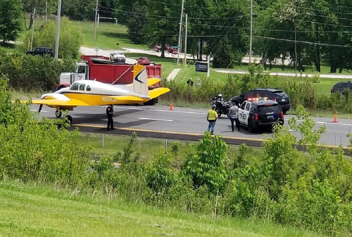 Plane emergency landing between moving cars on highway