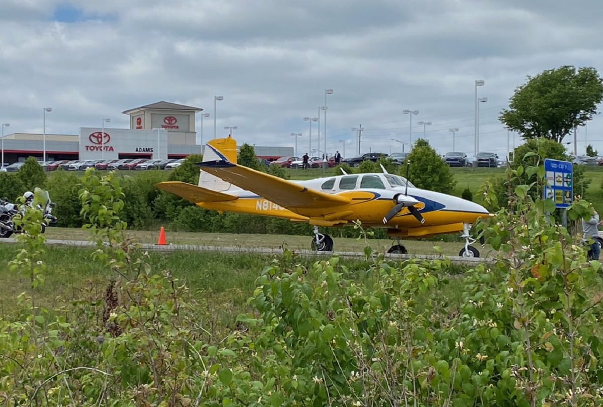 Plane emergency landing between moving cars on highway