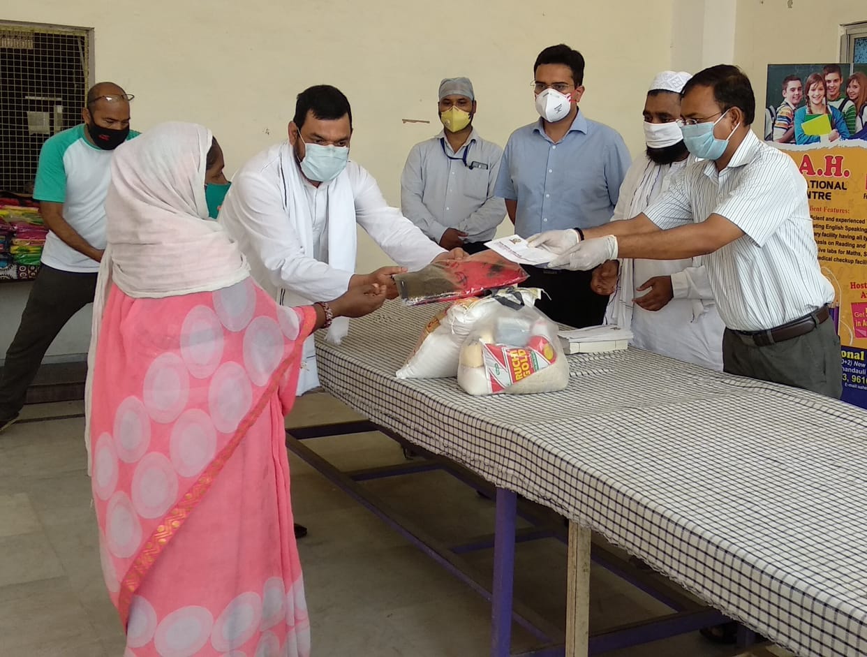 The commissioner distributed relief material to the needy