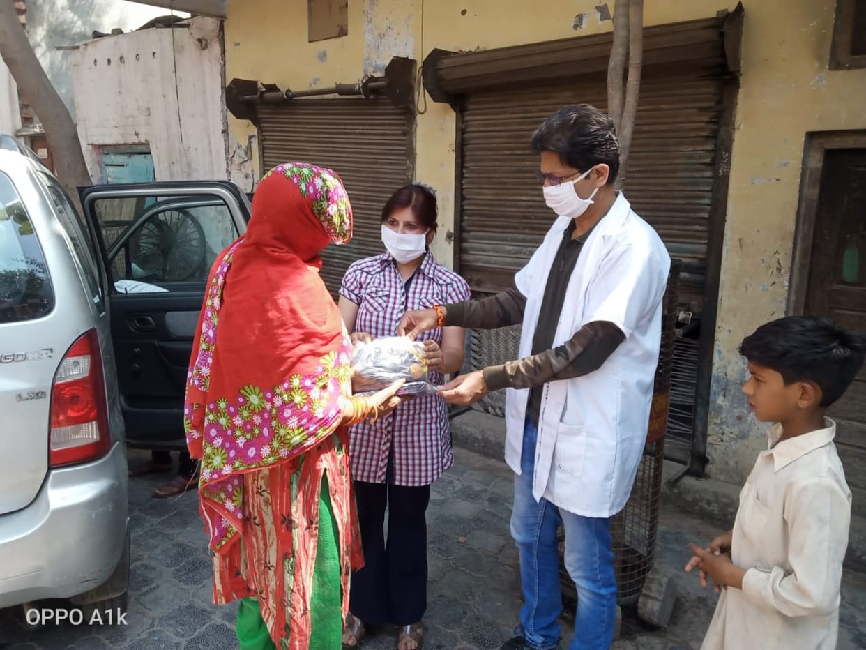 Distribution of ration materials to 22 poor families