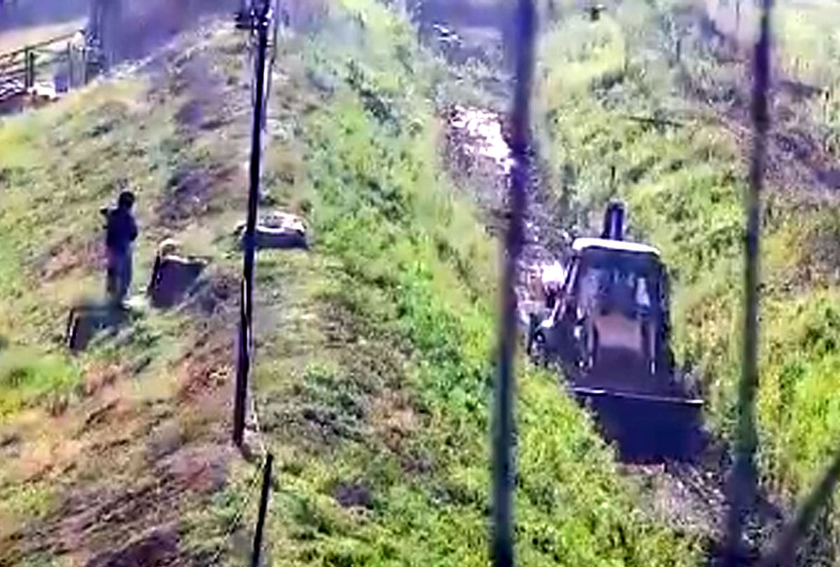 under security cover of BSF Jammu Kashmir Irrigation authorities cleaning Ranbir Canal close to border