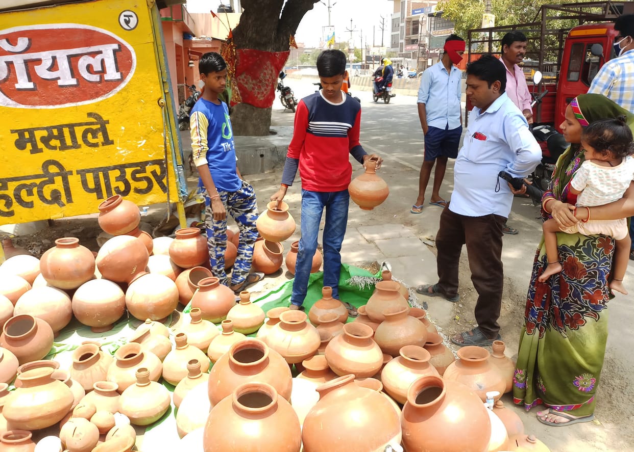 Clay pot and jug shops adorned, very few customers coming