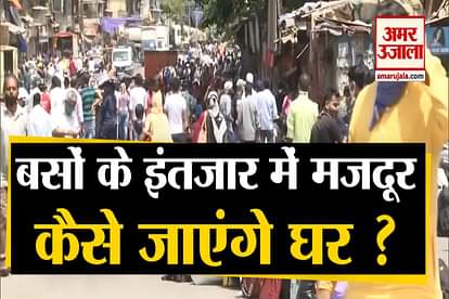 migrant workers come in large numbers on the streets to board buses in dharavi mumbai