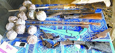 Weapons and grenades found in the closet of the tubewell of Kesarpur head