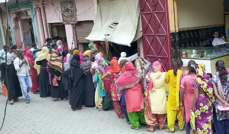 Crowd of women at sub post office