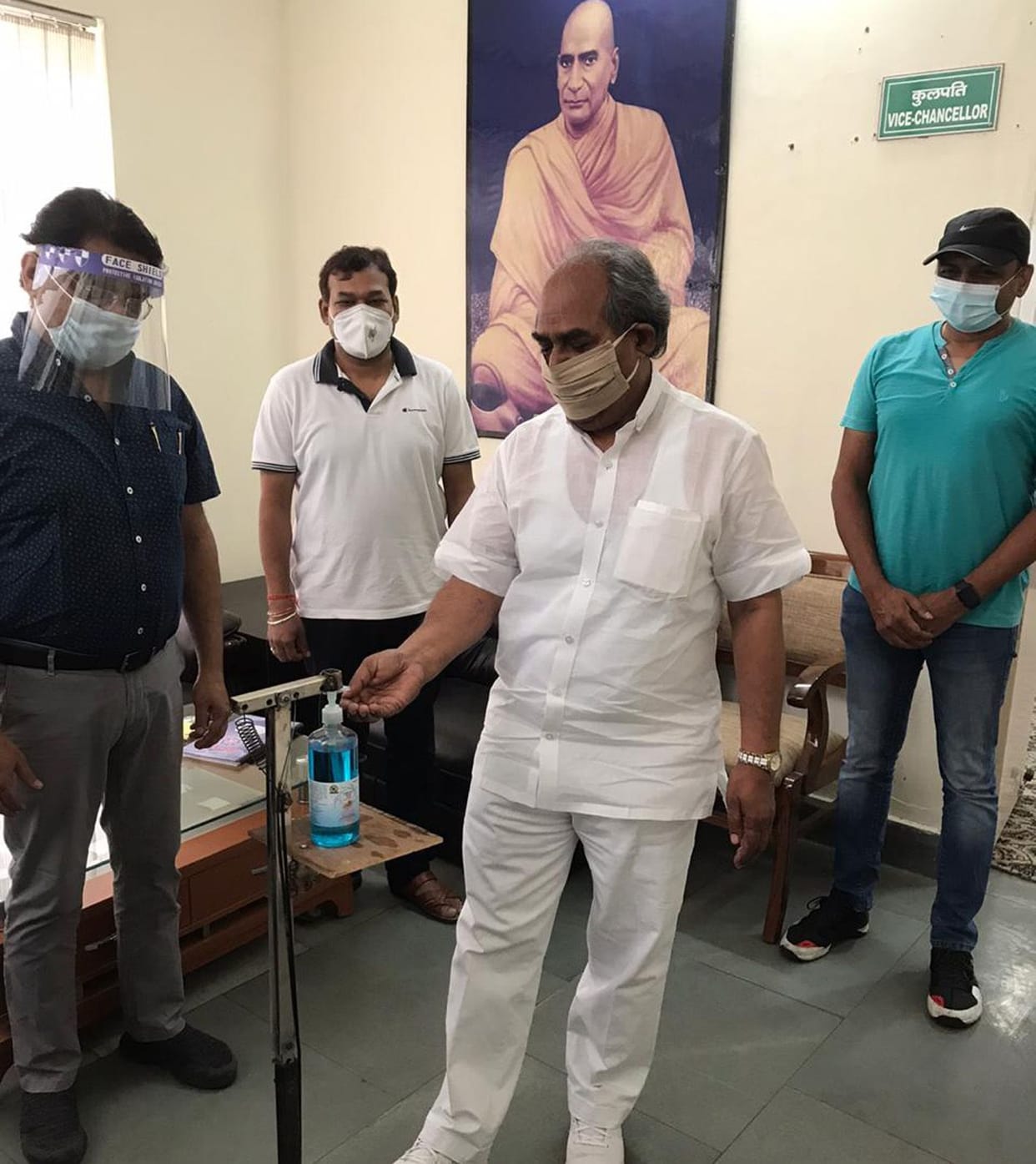 Construction of pandal operated hand sanitizer distancing machine