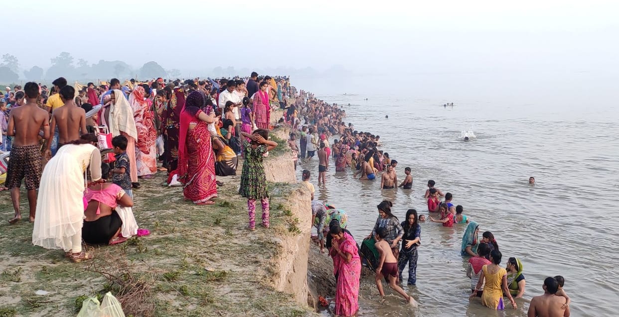 Dip despite ban, devotees gathered
