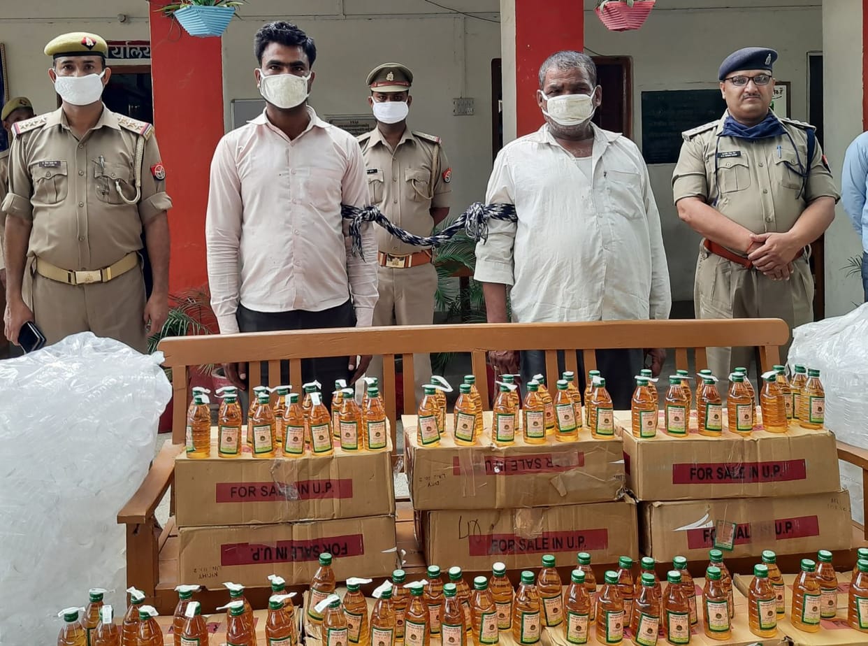 Caught of illicit liquor, two arrested