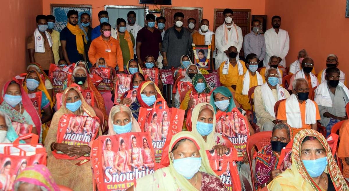 Clothes distributed among the poor near Baleshwar temple, then in the afternoon, the elderly got freshly dressed food