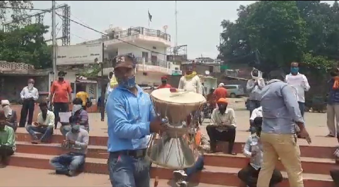 protest of auto drivers demonstrating by playing damru and thali