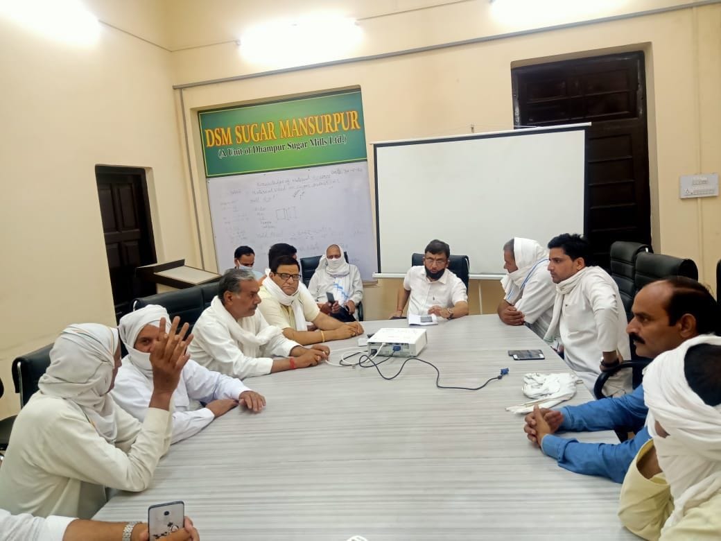 Farmers meet mill officials