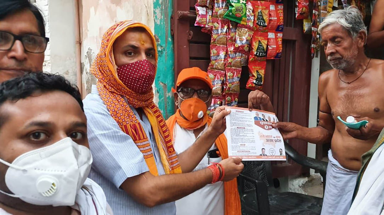 On the first anniversary of the Modi government, leaflets distributed from house to house