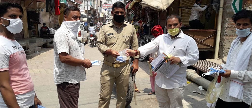 BJP workers distributed sanitizer and mask
