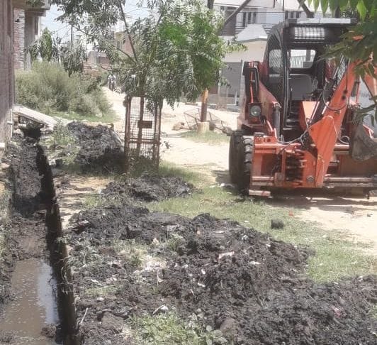 Cleaning of drains in wards, lifting silt