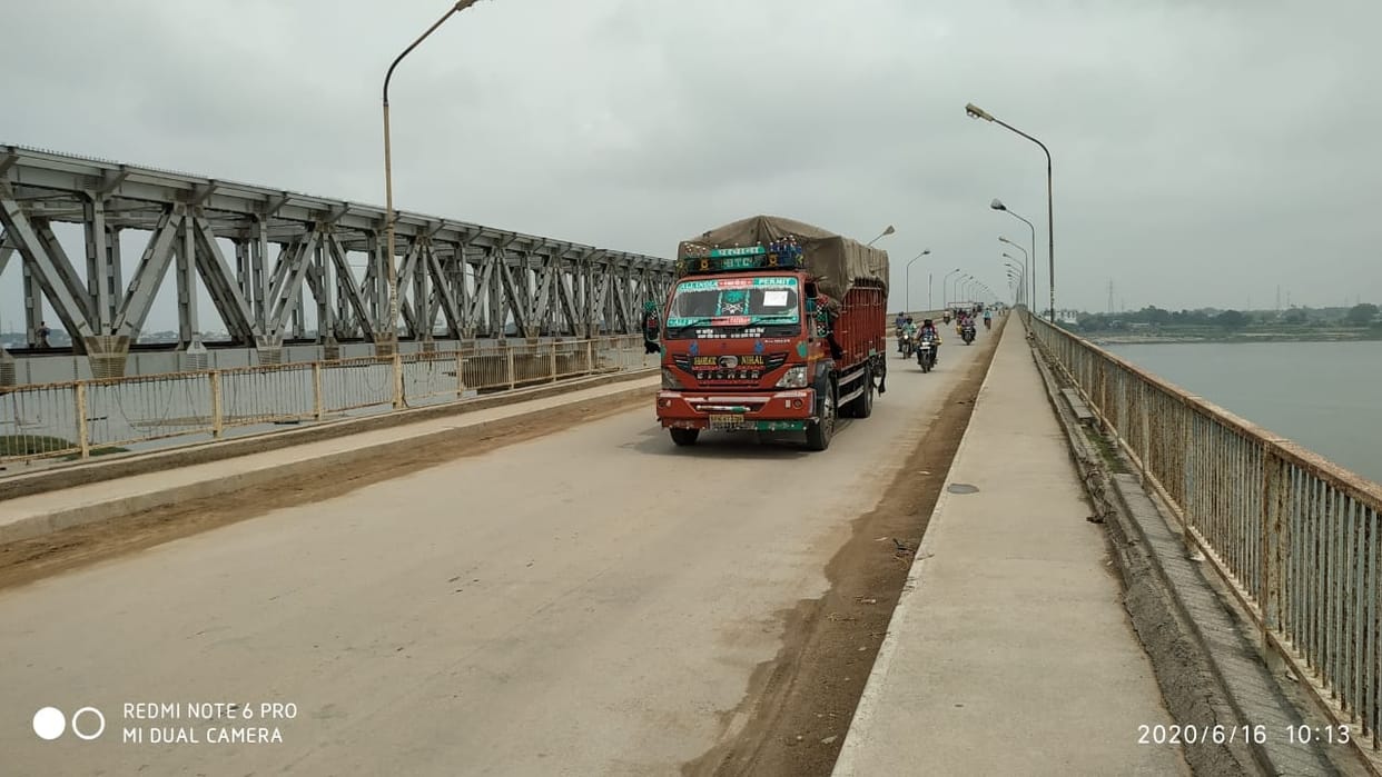 Heavy vehicles filling the bridge from the bridge even after the stop