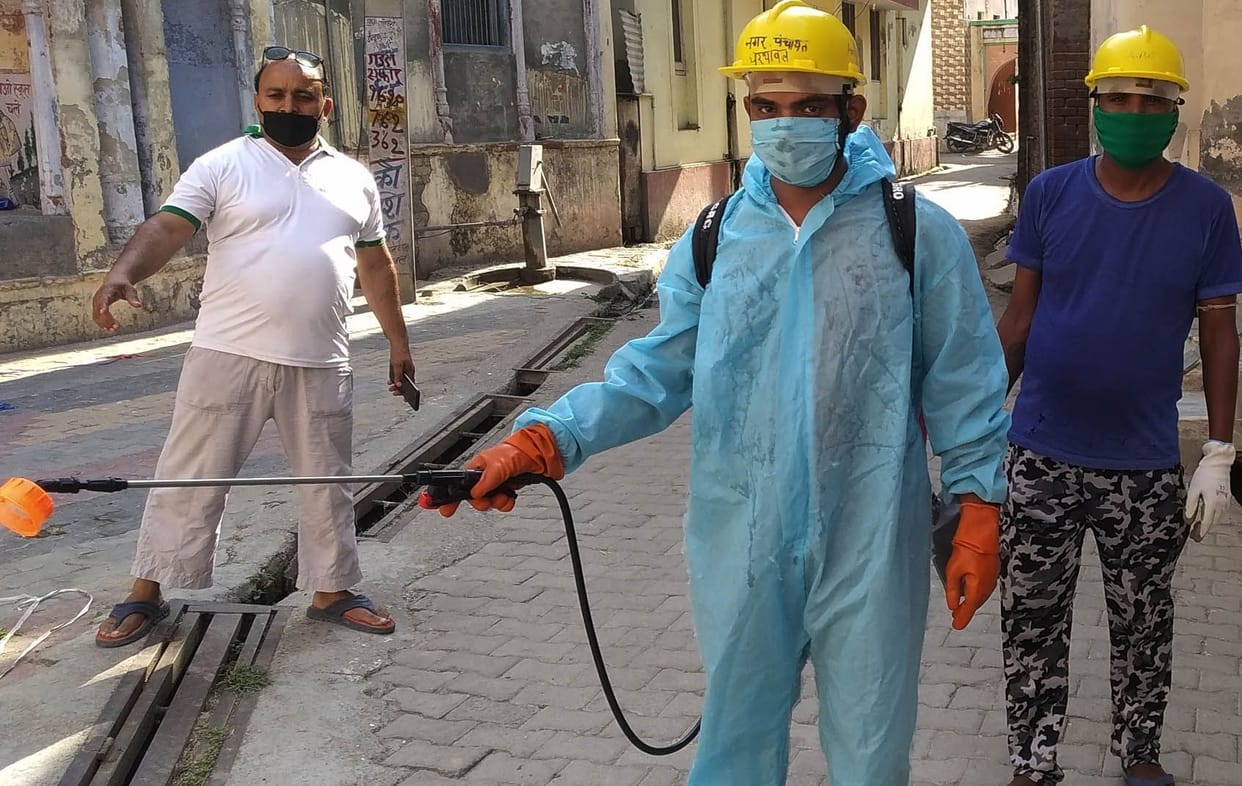 Sanitize the locality by wearing PPE kit