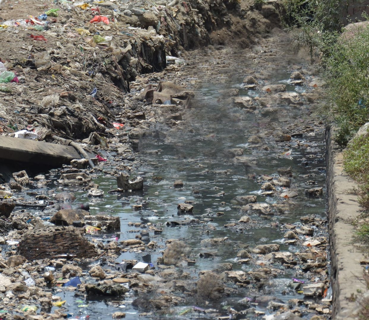 Closed sewer, water flowing in the colony