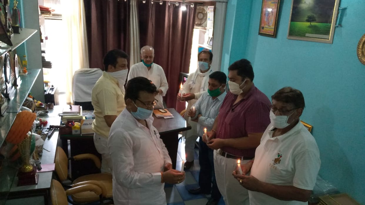 Tributes paid to martyrs by burning candles