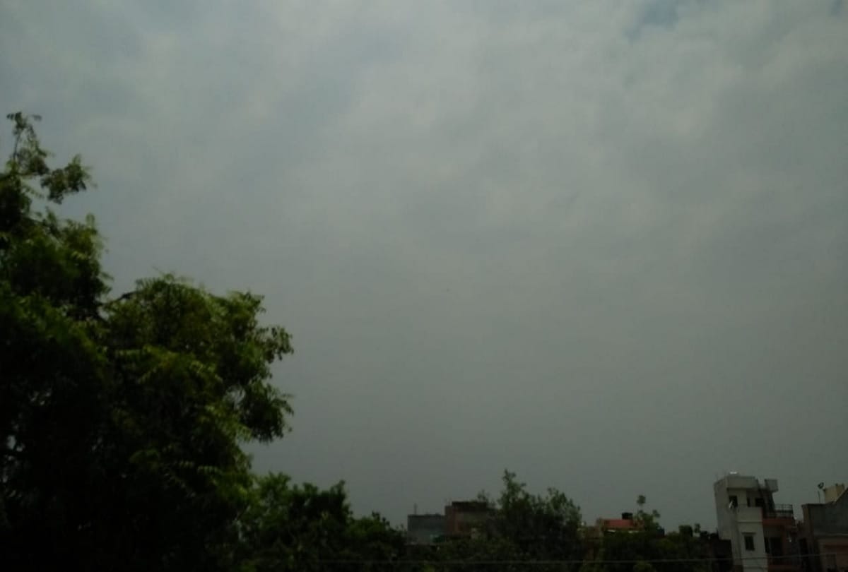 Solar eclipse 2020 seen in delhi NCR pictures of moon covering sun in cloudy sky