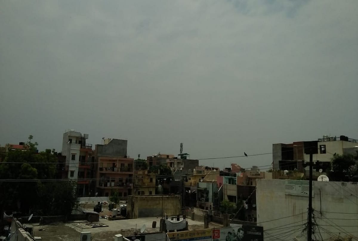 Solar eclipse 2020 seen in delhi NCR pictures of moon covering sun in cloudy sky