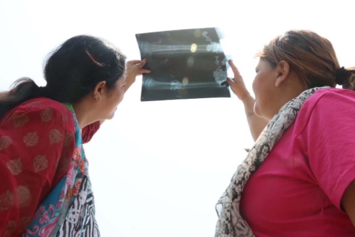 Solar ecalipse: reflection on paper, support of X-ray somewhere, it is how people see the surya grahan