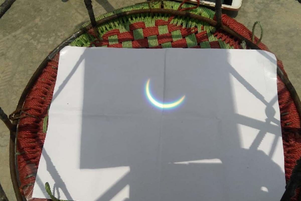 Solar ecalipse: reflection on paper, support of X-ray somewhere, it is how people see the surya grahan